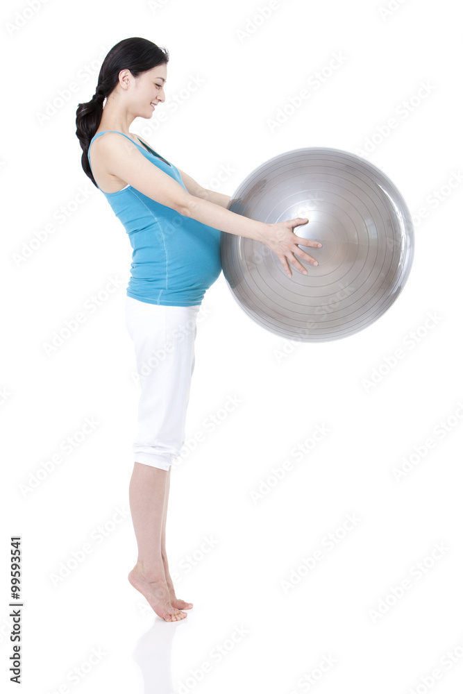 Young pregnant woman and fitness ball