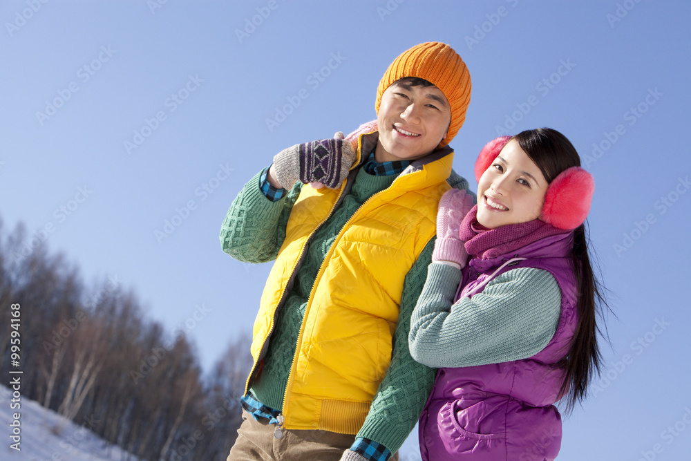 Happy young couple in ski resort