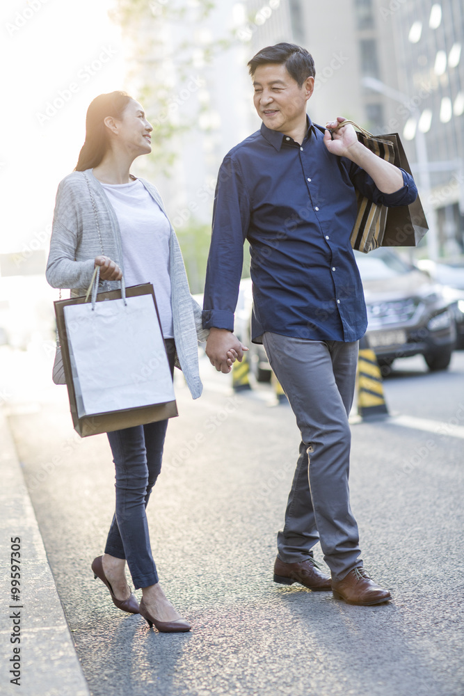 Happy mature couple shopping