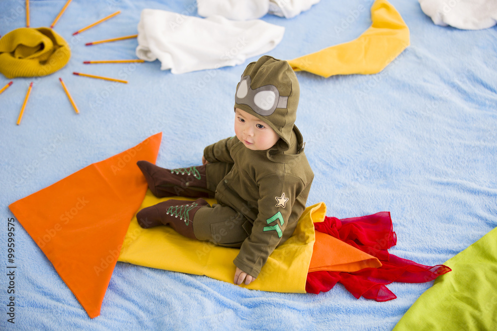 Cute baby sitting on rocket