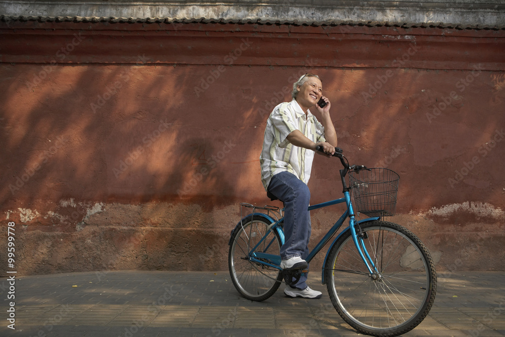 Portrait Of Elderly Man On A Bicycle