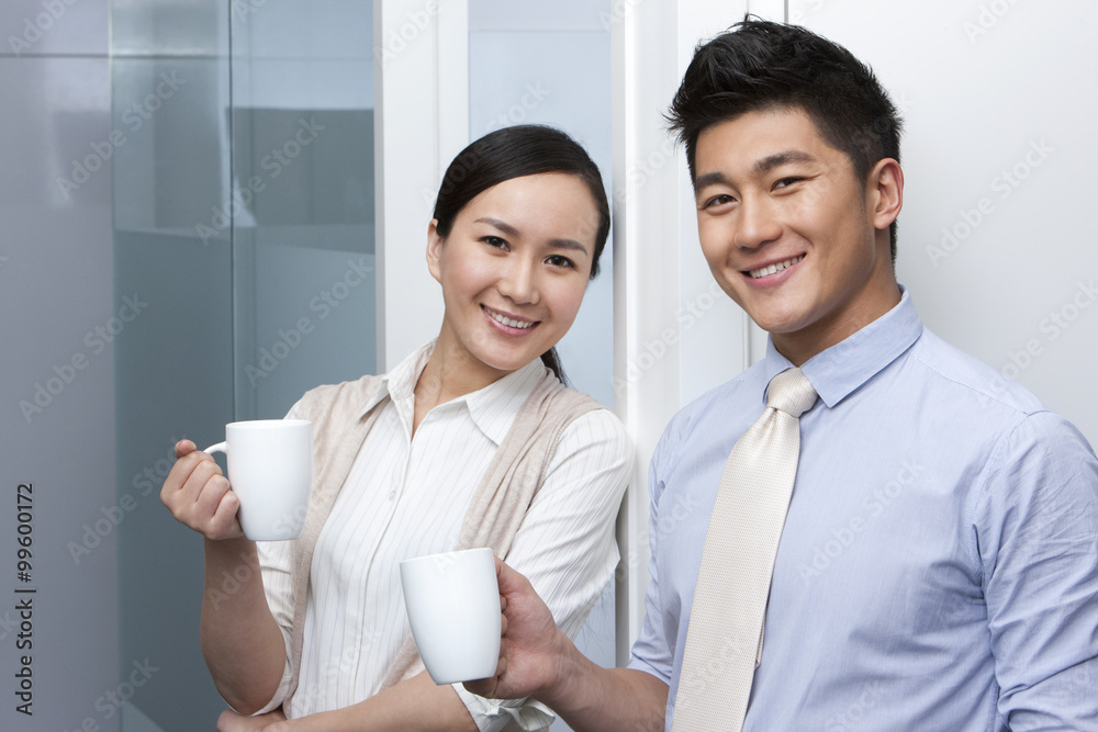 Smiling businesspeople during a coffeebreak