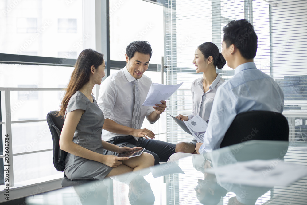 Young business people talking in meeting