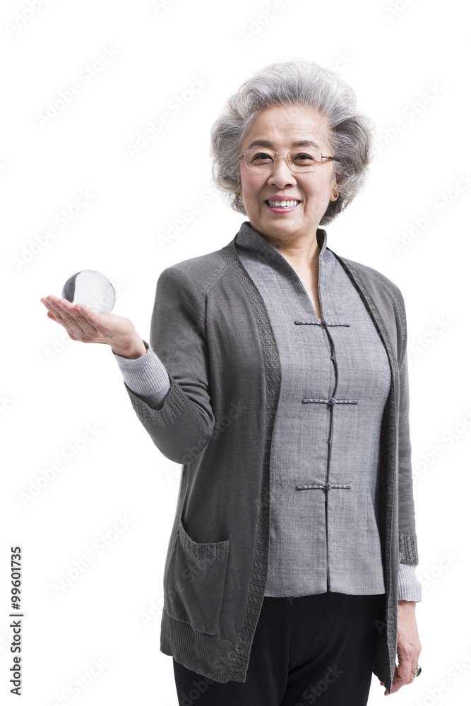 Senior woman with crystal ball