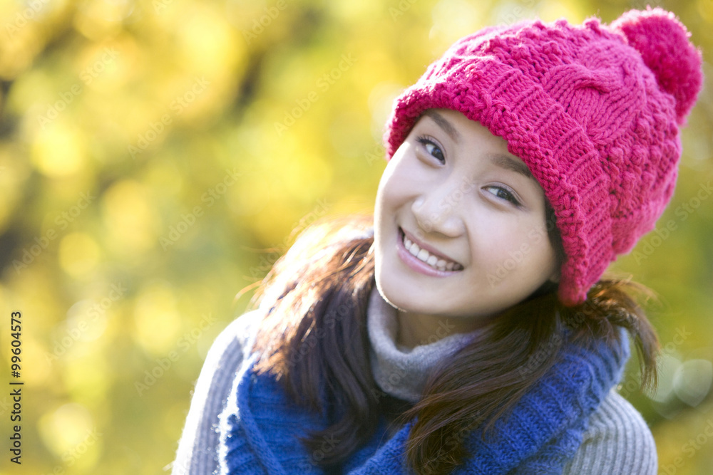 Young Woman in a Park in Autumn