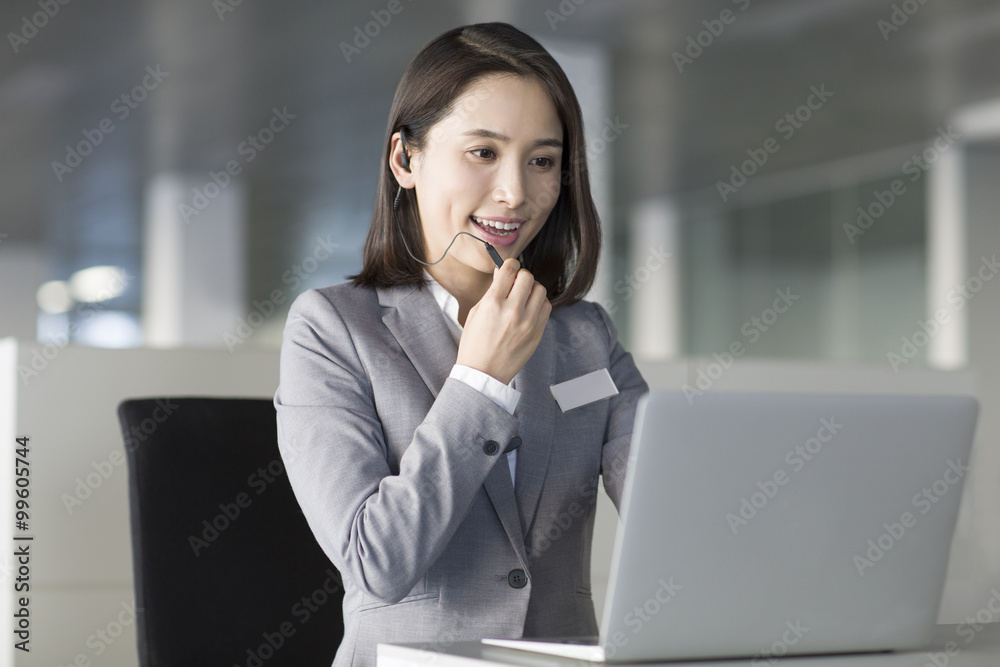 Young businesswoman using laptop