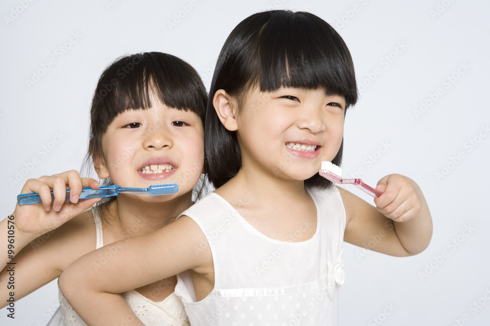 Little girls brushing teeth