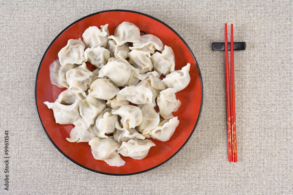 Plate Of Dumplings And Pair Of Chopsticks