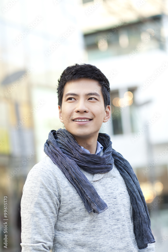 Portrait of fashionable young man in city