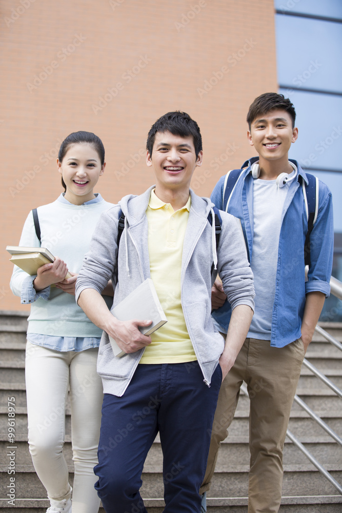 Young college students outside library