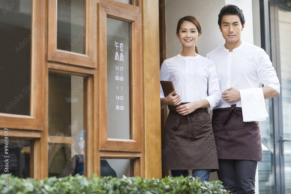 Wait staff standing in restaurant doorway