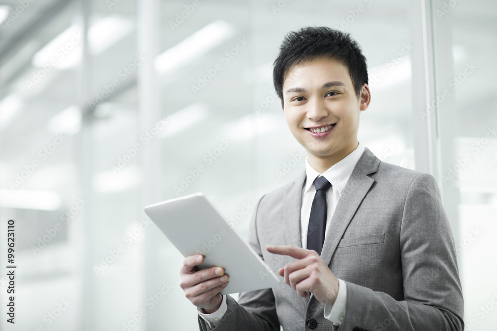 Young businessman with digital tablet