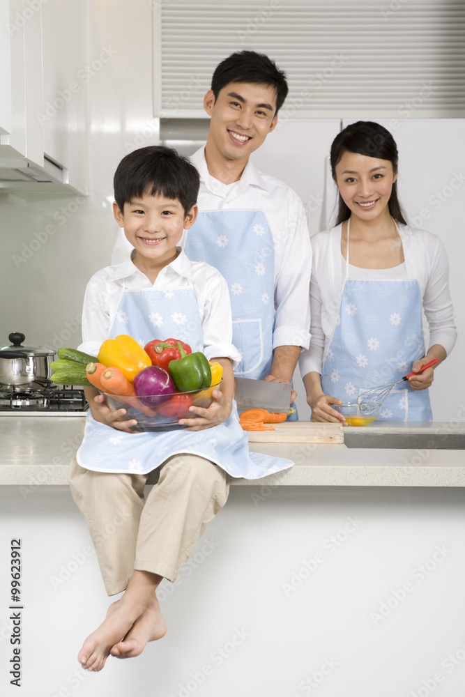 Family cooking in kitchen