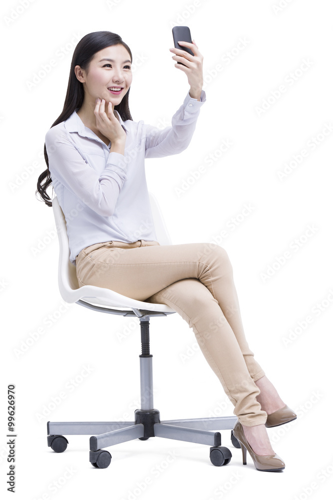 Young woman doing self portrait photography