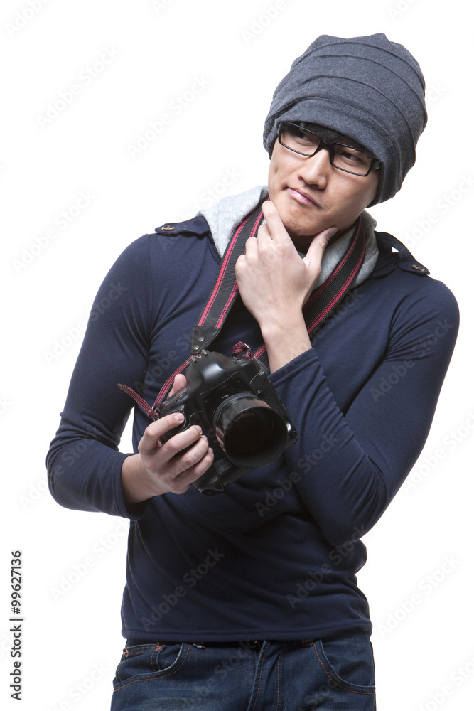 Cool young photographer with camera