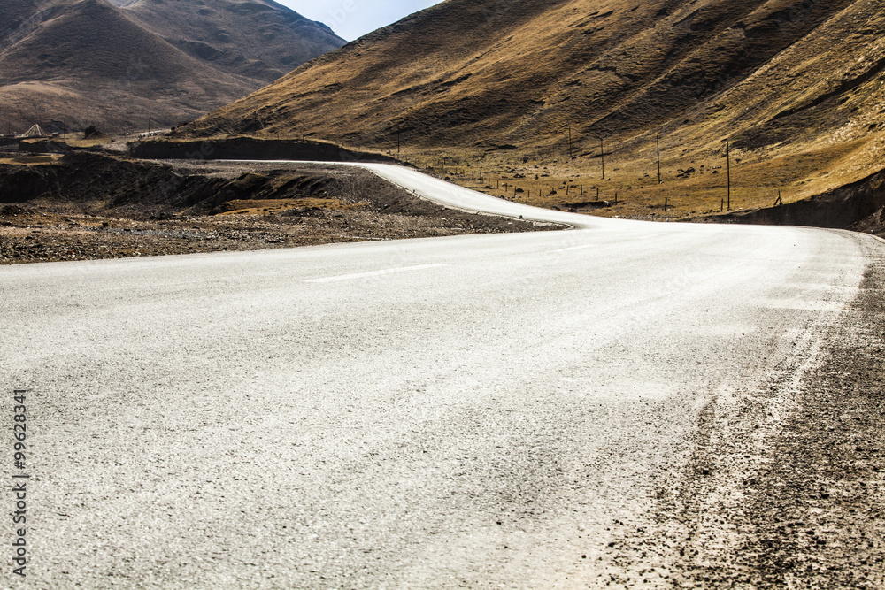 Road going through wilderness area into Qilian Mountain in Qinghai province, China