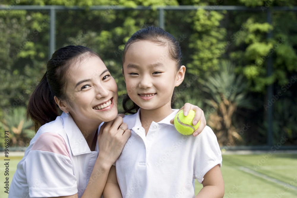 Mother and daughter on the tennis court