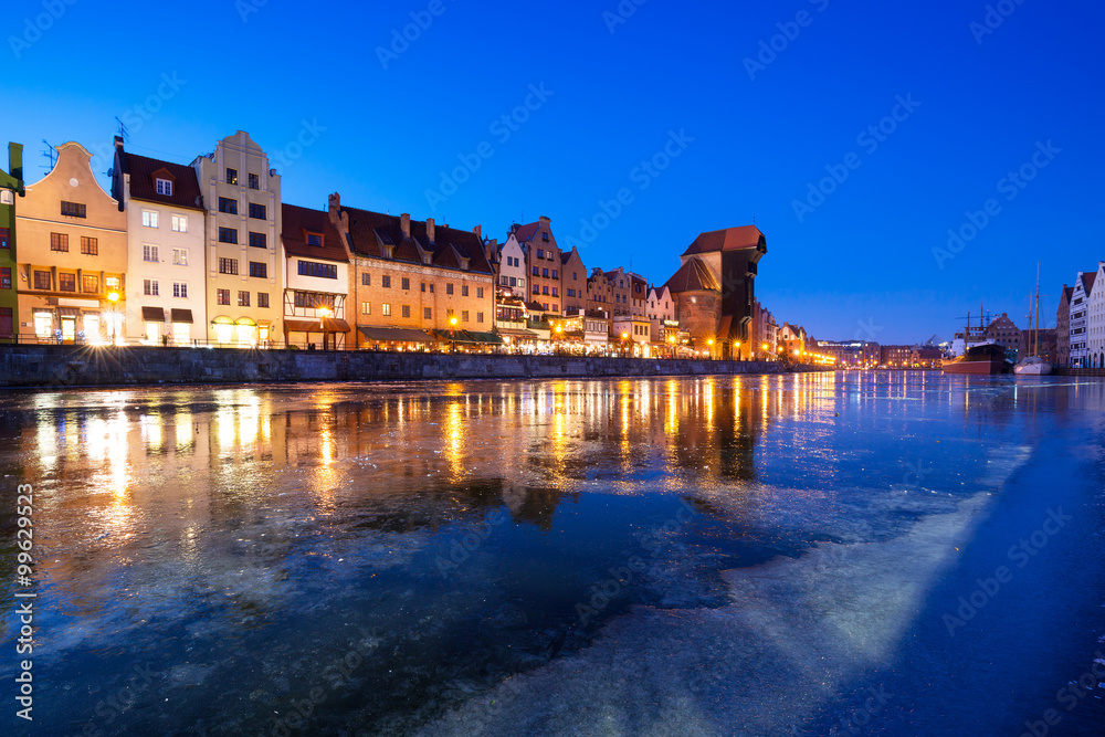 The old town of Gdansk at frozen Motlawa river, Poland