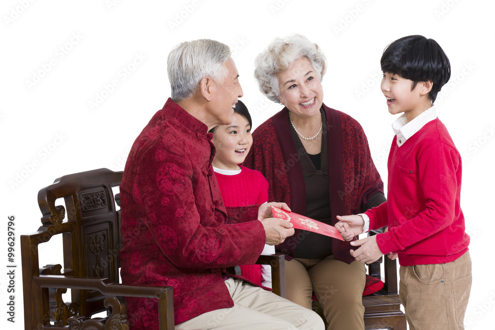 Grandparents giving red pocket to grandson