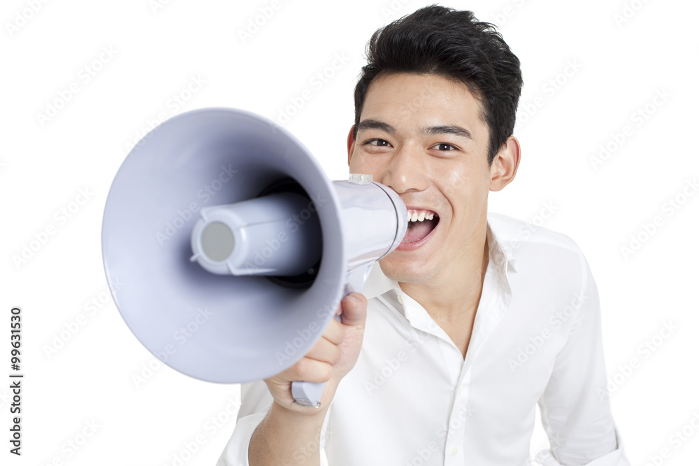 Young man cheering through a megaphone