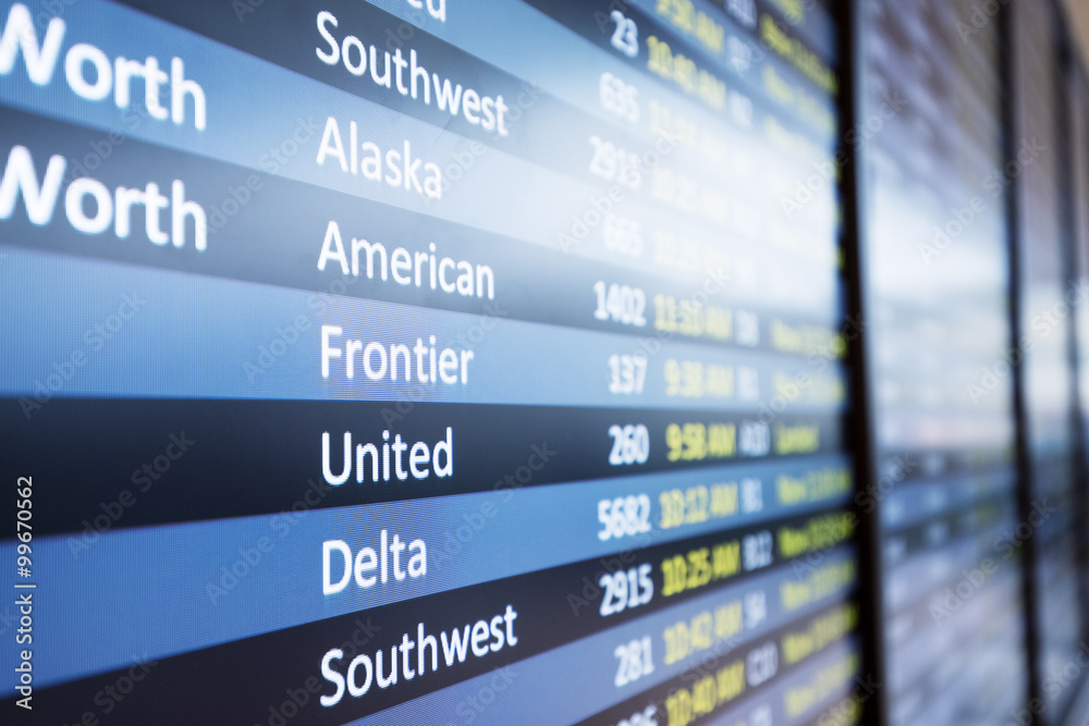 info of flight on billboard in airport