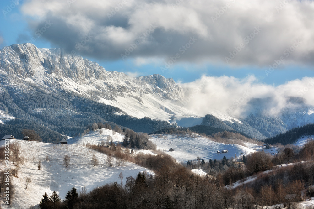 Sunny day of a winter, on wild transylvania hills with Bucegi mountains in background.. 09.01.2016. 