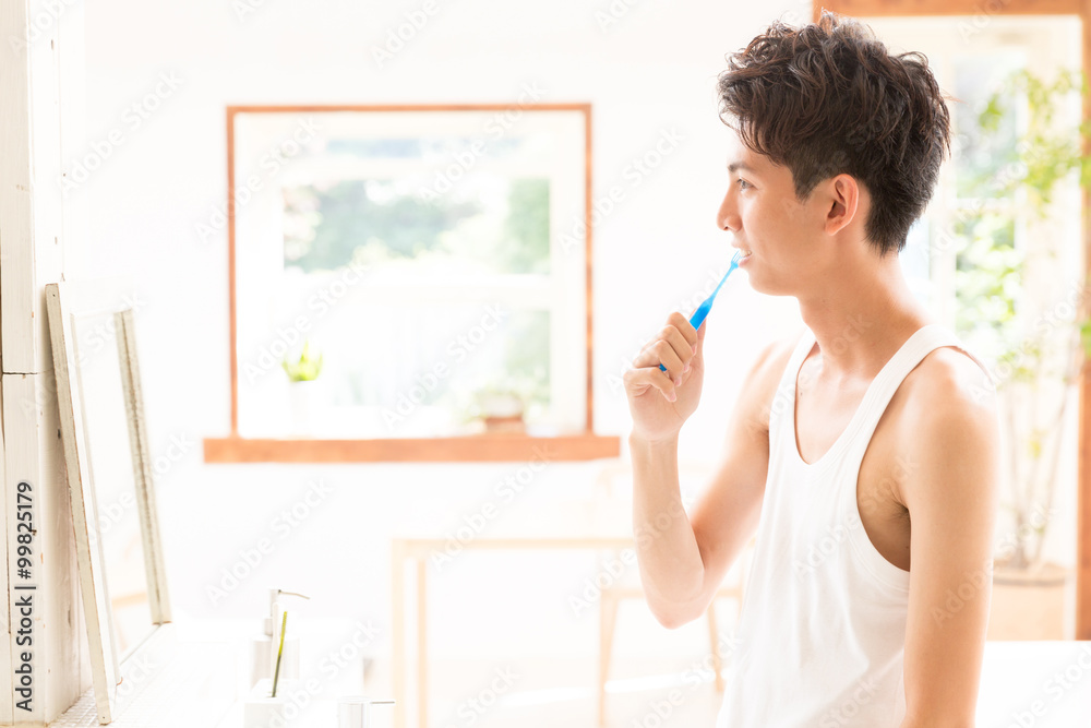 young asian man tooth care image