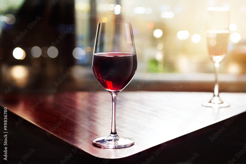  wine glass in entertaining room among sunset window background