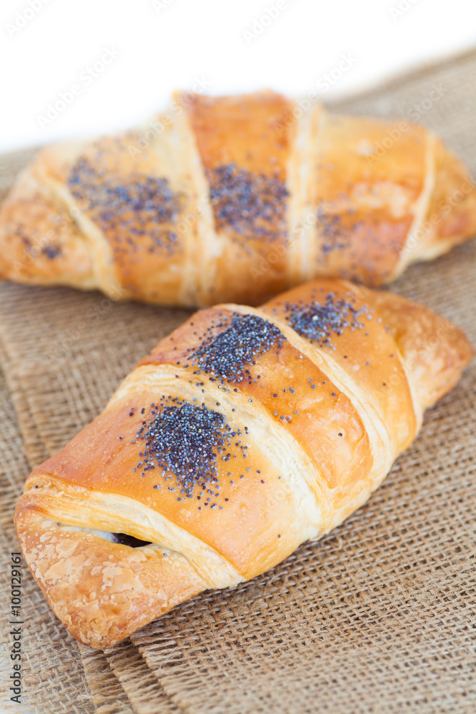 Fresh and tasty croissant over white background