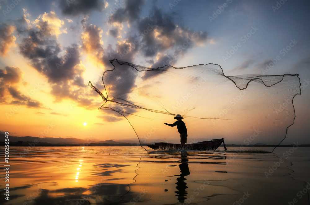 Fisherman of Bangpra Lake in action when fishing, Thailand.