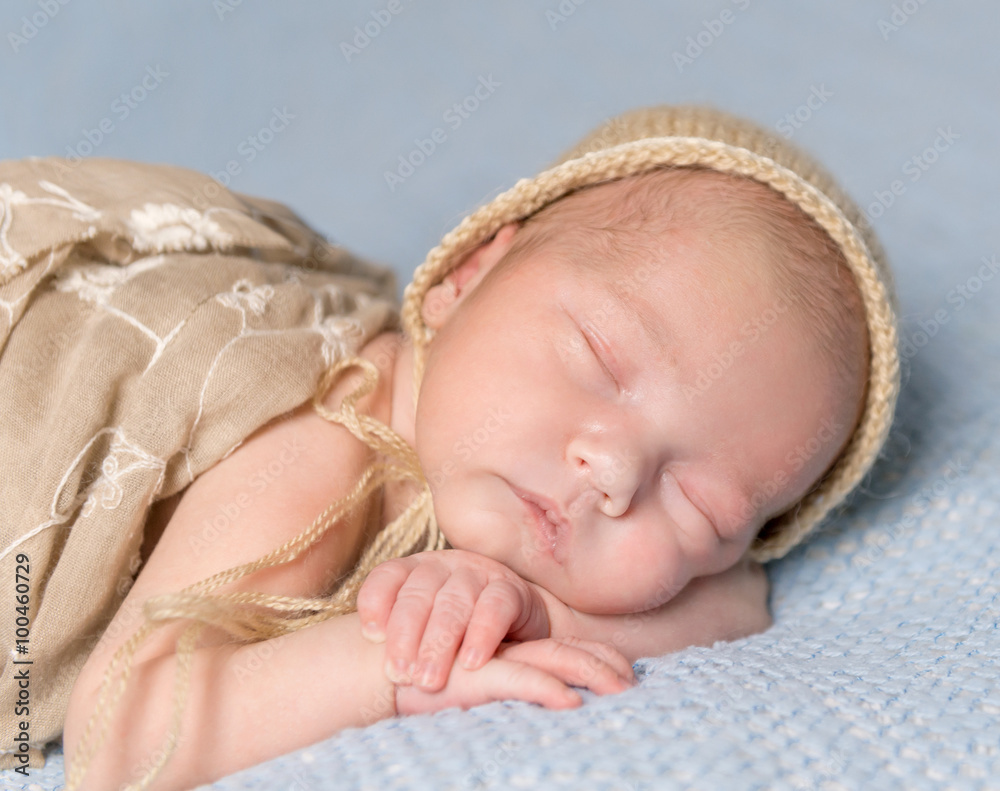 sleeping newborn baby with lovely cheeks