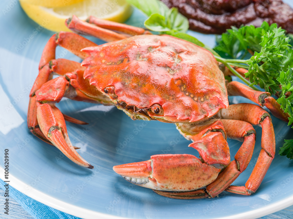 Cooked crab with lemon and herbs.