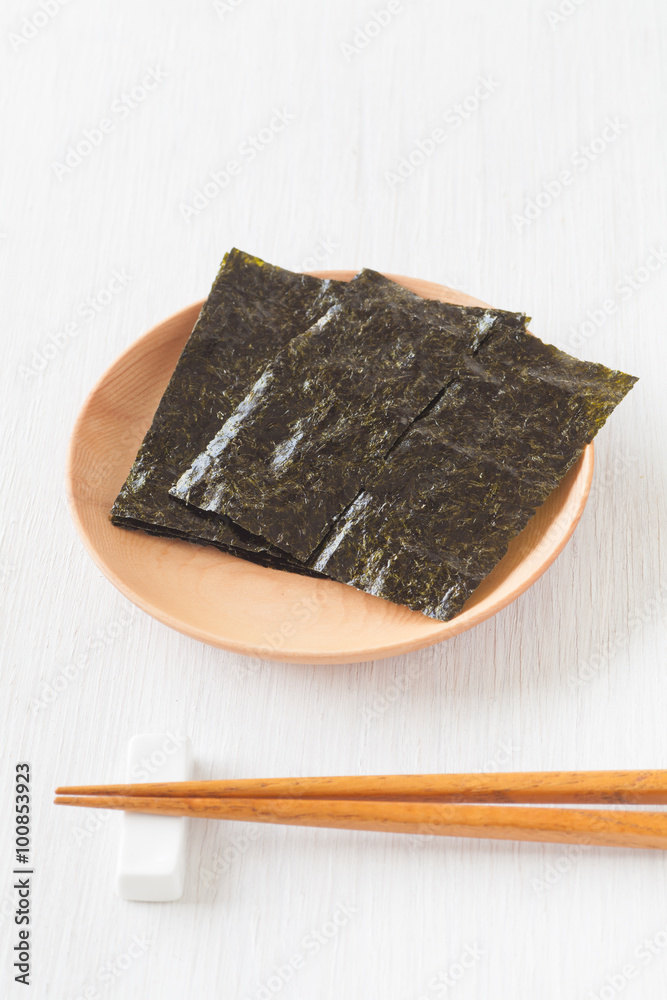 Nori , Japanese edible seaweed used as a wrap for sushi and onigiri