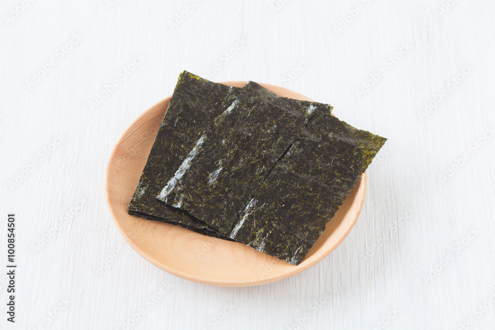 Nori , Japanese edible seaweed used as a wrap for sushi and onigiri