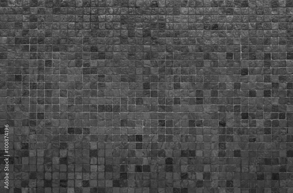 Grey and black mosaic wall texture and background..