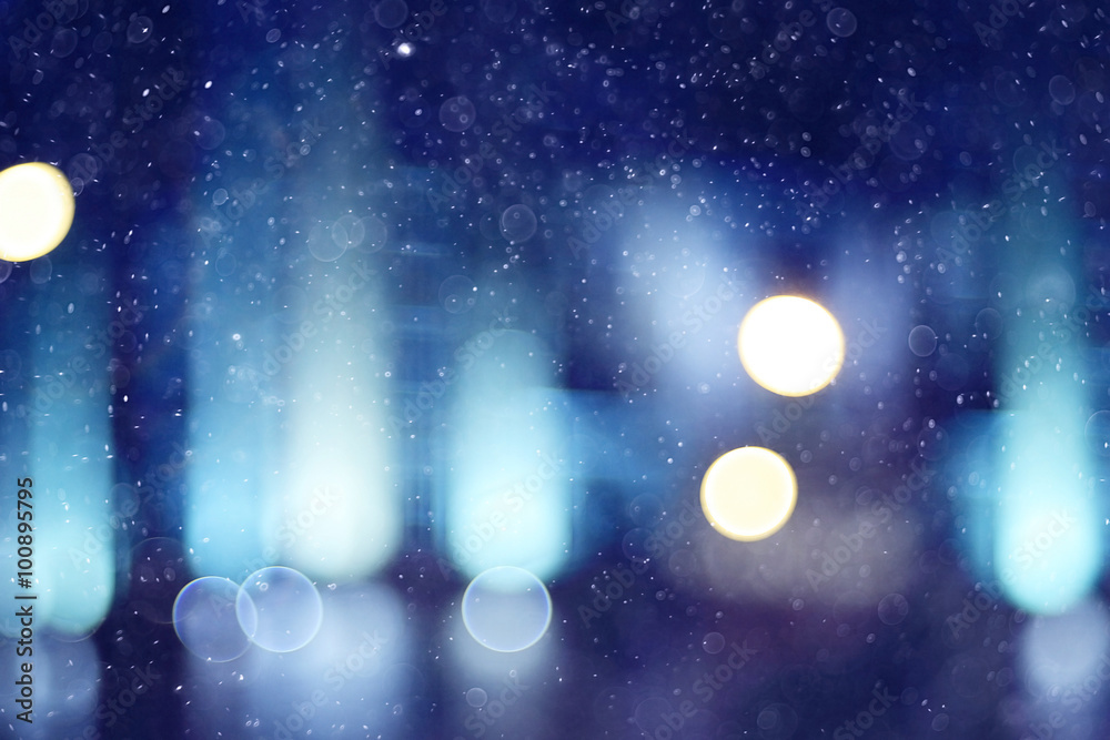 blurred background snow snowfall night lights glass