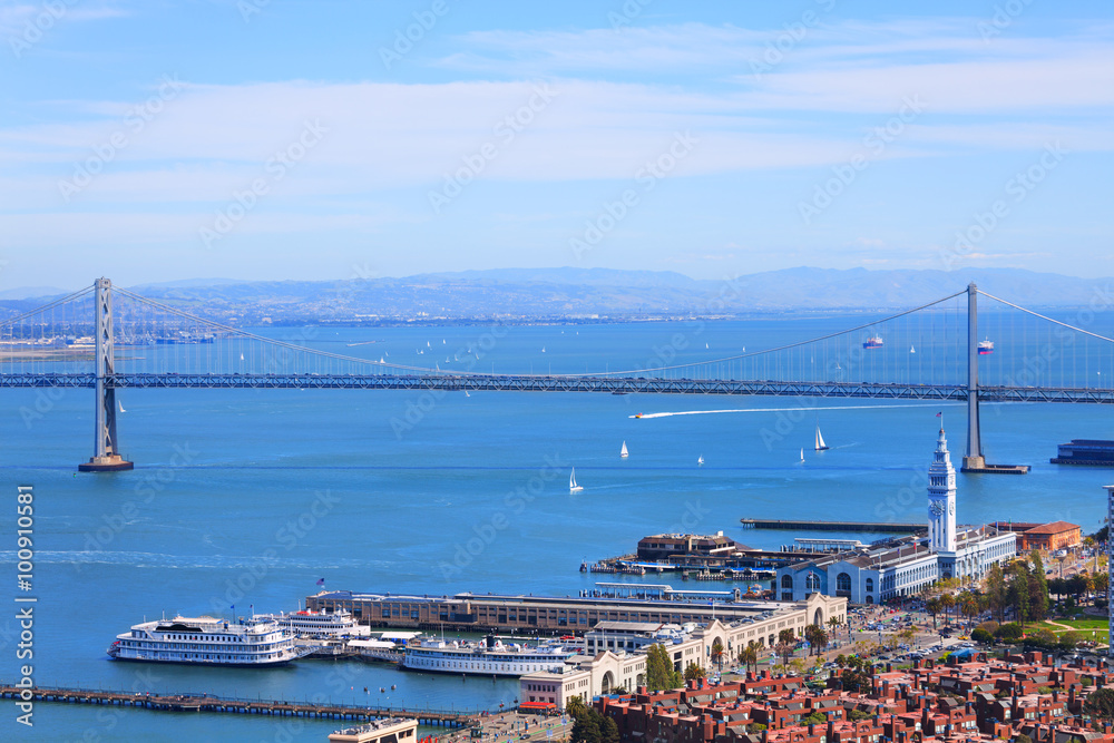 Oakland Bay Bridge in San Francisco and port tower