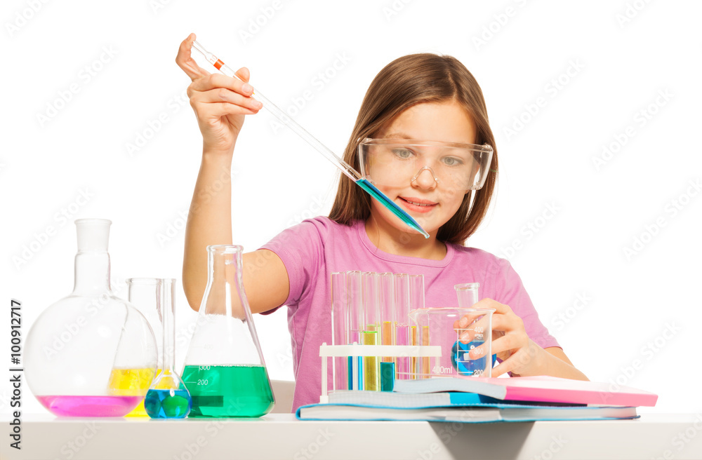 Young girl doing her chemical test in laboratory