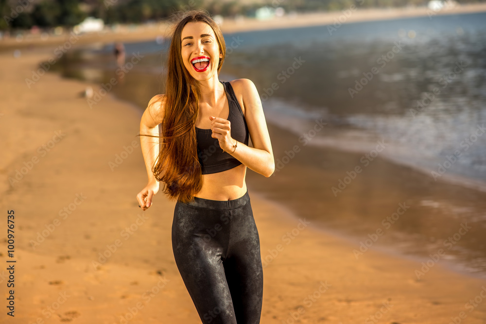 Woman running on the sandy beach