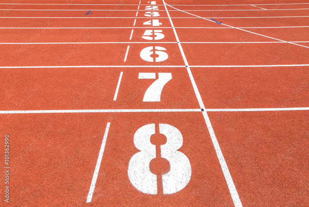 Running track in stadium with numbers.