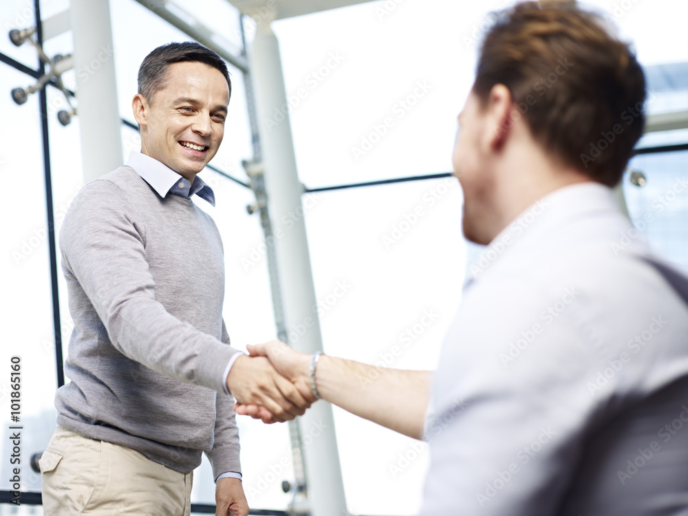 business executives shaking hands