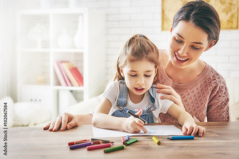 Mother and daughter together paint