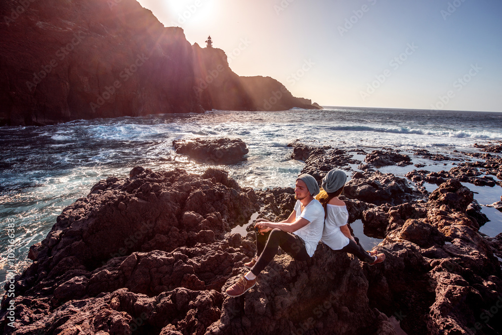 Couple on the rocky coast