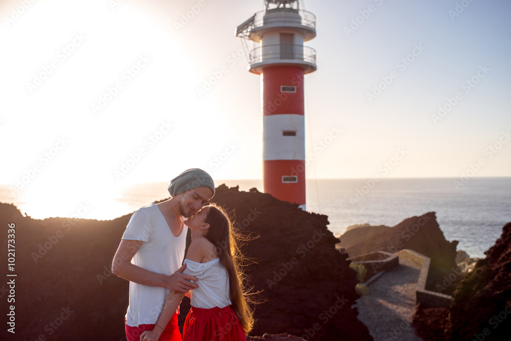 Couple standing together near the lighthouse