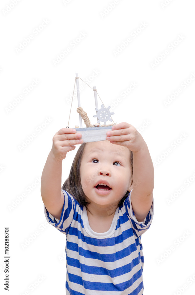 Little asian girl with boat toy over white