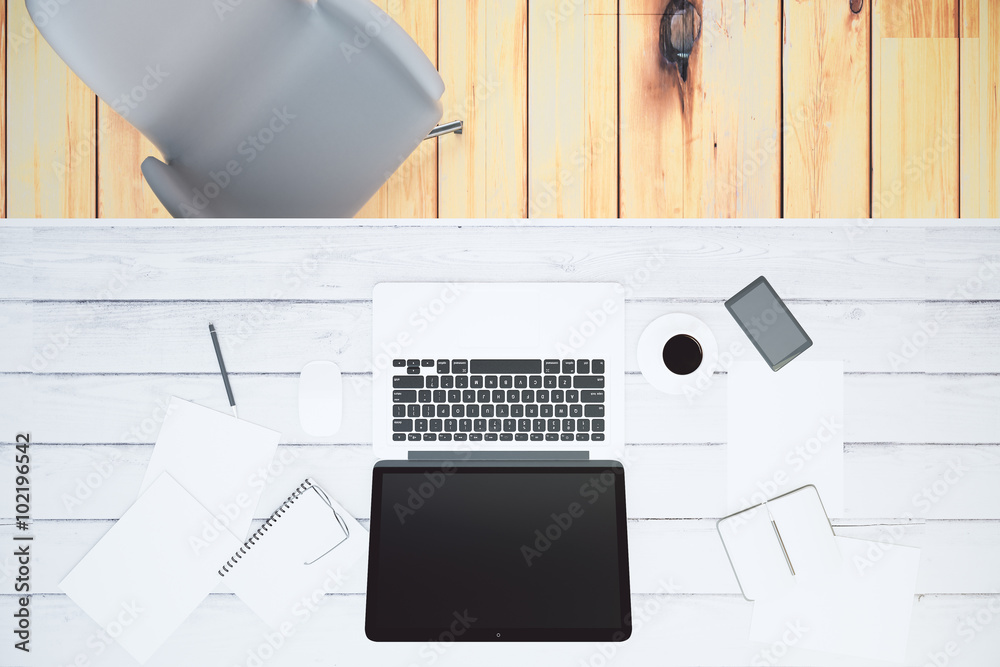 Top view of a white wooden desk with blank laptop screen, mock u