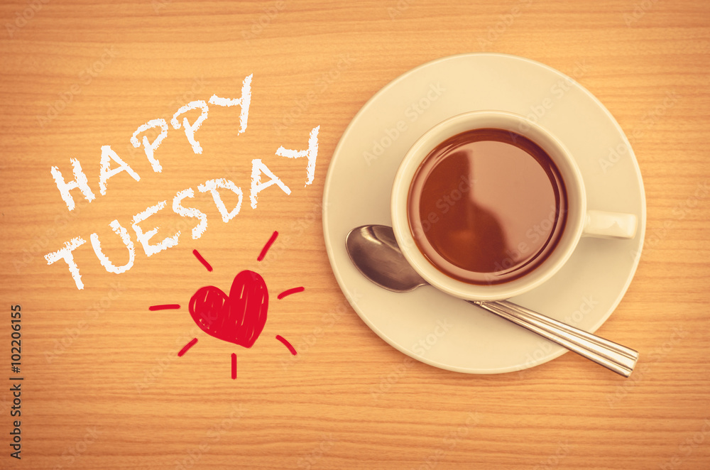 Happy Tuesday with coffee cup on table