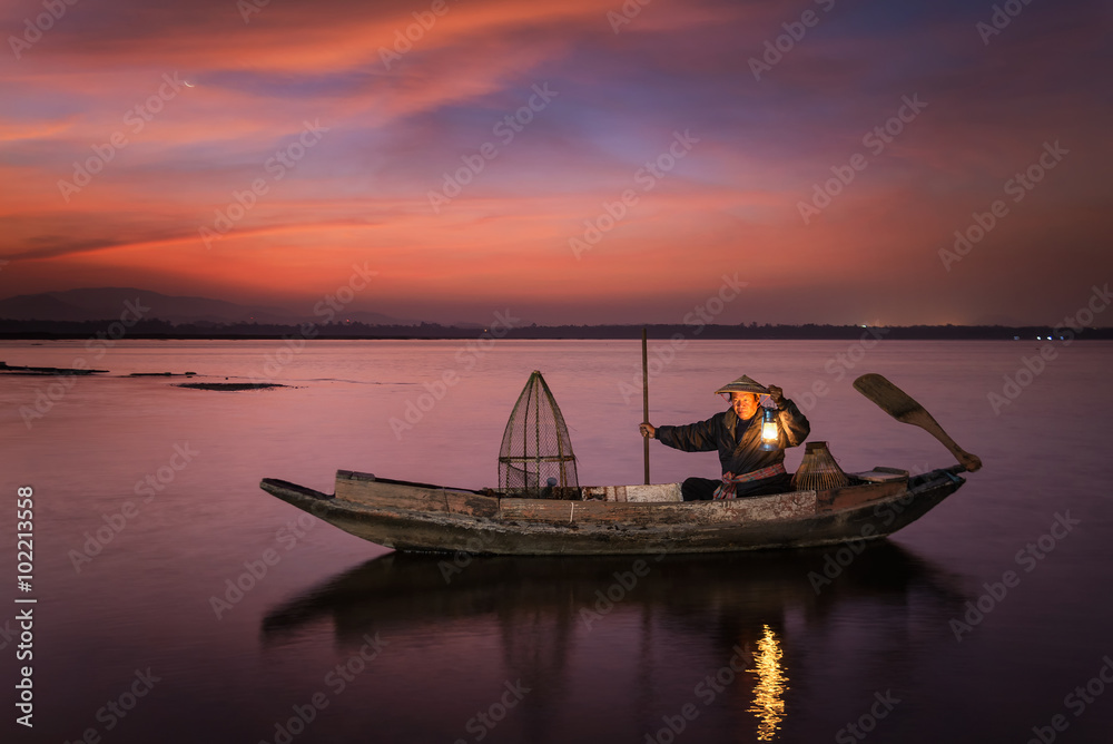 Fisherman of Bangpra Lake in action when fishing, Thailand