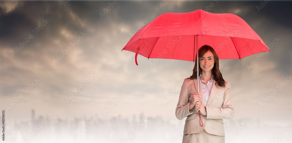 迷人的女商人撑着红色雨伞的合成图像