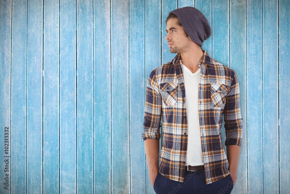 Composite image of confident hipster looking away while standing